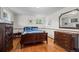 Spacious bedroom with hardwood floors, large mirror, and classic wood furniture at 1322 Wicklow St, Boulder, CO 80303