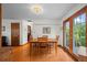 Inviting dining room featuring hardwood floors, a classic wooden table set, and natural light at 1322 Wicklow St, Boulder, CO 80303