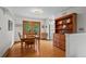 Traditional dining room featuring hardwood floors, wood furniture, and french doors leading to the backyard at 1322 Wicklow St, Boulder, CO 80303
