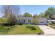 Attractive single-Gathering home with a neatly landscaped front yard, mature trees, and an attached garage at 1322 Wicklow St, Boulder, CO 80303