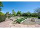 Landscaped garden area with multiple raised garden beds on a sunny day at 1322 Wicklow St, Boulder, CO 80303