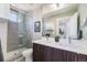 Modern bathroom offers double sinks, a sleek glass-enclosed shower, and contemporary fixtures for a spa-like experience at 2726 Federal Blvd # 1, Denver, CO 80211