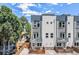 Modern townhouse exterior with clean lines, balconies, and landscaped front yards, offering stylish urban living at 2726 Federal Blvd # 1, Denver, CO 80211