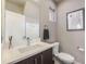 Stylish powder room boasts modern fixtures, elegant countertop, and tasteful decor for guests' comfort and convenience at 2726 Federal Blvd # 1, Denver, CO 80211
