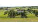 Aerial view of house on large lot with mountain views and wooden fence at 306 Andrea Cir, Parker, CO 80138