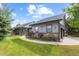 Exterior of ranch style home with landscaped yard and attached garage at 306 Andrea Cir, Parker, CO 80138