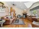 Spacious living room with hardwood floors, fireplace, and large windows at 306 Andrea Cir, Parker, CO 80138