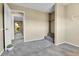 Spare bedroom featuring neutral carpeting with a walk-in closet and adjacent door at 17769 E Iowa Dr, Aurora, CO 80017