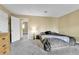 Bedroom featuring a queen-sized bed and neutral carpeting and paint at 17769 E Iowa Dr, Aurora, CO 80017