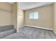 Carpeted room with closet and large window at 17769 E Iowa Dr, Aurora, CO 80017