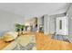 Bright living room with hardwood floors, a modern rug and a charming staircase at 17769 E Iowa Dr, Aurora, CO 80017