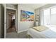 Bedroom with soft carpeting, comfortable bed, and a view through the doorway, creating an inviting space at 16737 Lake Helen Blvd, Mead, CO 80542