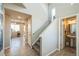 Bright entryway featuring hardwood floors and a staircase leading to the upper level at 16737 Lake Helen Blvd, Mead, CO 80542