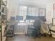 A dedicated workspace with multiple monitors, a comfortable chair, and ample desk space at 16737 Lake Helen Blvd, Mead, CO 80542