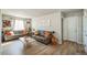 Comfortable living room with hardwood floors, stylish seating, and warm, inviting decor at 16737 Lake Helen Blvd, Mead, CO 80542