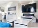 Modern living room showcasing contemporary decor, a wall-mounted TV, and an electric fireplace at 16737 Lake Helen Blvd, Mead, CO 80542
