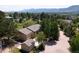 A high altitude view of the home, outbuilding and surrounding land and mountain views at 19235 Wakonda Way, Monument, CO 80132