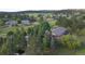 A captivating aerial perspective of the home, surrounded by verdant trees, offering both privacy and natural beauty at 19235 Wakonda Way, Monument, CO 80132