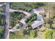 An aerial view showcases this property's expansive grounds and winding driveway, creating a park-like ambiance at 19235 Wakonda Way, Monument, CO 80132