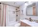 Stylish bathroom with tiled shower, modern vanity, and decorative mirror enhancing the space at 19235 Wakonda Way, Monument, CO 80132