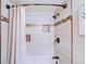 Close-up of the tiled shower showcasing the shower head and mosaic tile detail at 19235 Wakonda Way, Monument, CO 80132