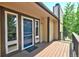 Inviting deck with wood flooring and views of surrounding lush greenery at 19235 Wakonda Way, Monument, CO 80132