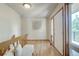 Bright entryway featuring hardwood floors, a bench, and a front door with sidelights at 19235 Wakonda Way, Monument, CO 80132