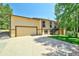 Exterior view featuring a two-car garage, concrete driveway, and well-maintained lawn at 19235 Wakonda Way, Monument, CO 80132