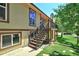 Exterior showcasing a staircase leading to a deck, with lovely landscaping and yard at 19235 Wakonda Way, Monument, CO 80132