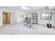 Bright home office featuring a modern desk, shelving unit, and ample natural light from two windows at 19235 Wakonda Way, Monument, CO 80132