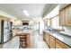 Spacious kitchen with stainless steel appliances, a central island, and ample counter space at 19235 Wakonda Way, Monument, CO 80132