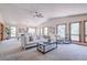 Bright living room with vaulted ceilings, comfortable seating, and large windows at 19235 Wakonda Way, Monument, CO 80132