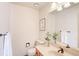 Cozy powder room with a floral display, framed artwork, and bronze faucet at 19235 Wakonda Way, Monument, CO 80132