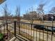 View from balcony overlooks a tree-lined street and park at 7440 Lowell Blvd # B, Westminster, CO 80030