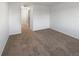 Spacious bedroom with neutral carpeting and double doors to hallway at 7440 Lowell Blvd # B, Westminster, CO 80030