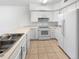 Kitchen boasts ample counter space and white cabinetry at 7440 Lowell Blvd # B, Westminster, CO 80030