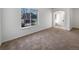 Bright living room with neutral carpeting and view of the street at 7440 Lowell Blvd # B, Westminster, CO 80030