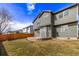 Backyard of the home with a circular patio, wood fence, and lush green grass at 4630 E 135Th Way, Thornton, CO 80241