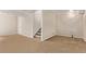 Large carpeted basement area with stairs to main floor at 4630 E 135Th Way, Thornton, CO 80241