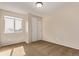 Cozy bedroom features a large window, soft carpet, and a closet with bi-fold doors at 4630 E 135Th Way, Thornton, CO 80241