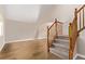 Bright entryway featuring hardwood floors, neutral walls, and a staircase with wood railing at 4630 E 135Th Way, Thornton, CO 80241