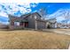 Spacious gray home featuring a well-maintained lawn, two-car garage, and inviting curb appeal at 4630 E 135Th Way, Thornton, CO 80241