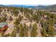 Elevated home with mountain views and surrounding homes at 9189 Fallen Rock Rd, Conifer, CO 80433