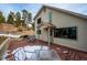 Spacious back deck with seating area, offering mountain views at 9189 Fallen Rock Rd, Conifer, CO 80433