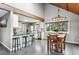 Modern kitchen with granite countertops, white cabinets, and stainless steel appliances at 9189 Fallen Rock Rd, Conifer, CO 80433