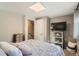 Bedroom featuring a TV on shelving, storage, neutral colors and stairs at 975 S Queen Way, Lakewood, CO 80226