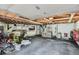 Functional garage with ample storage, work space, tool organization, and durable flooring at 975 S Queen Way, Lakewood, CO 80226