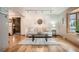 Living room featuring hardwood floors, neutral tones, and access to other rooms making it a great space to relax in at 975 S Queen Way, Lakewood, CO 80226
