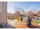 Deck with fire pit and seating area overlooking yard at 19805 E 58Th Pl, Aurora, CO 80019