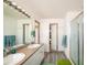 Double vanity bathroom with a shower and walk-in closet at 19805 E 58Th Pl, Aurora, CO 80019